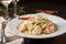 plate of fresh, linguine with shrimps in white wine sauce