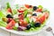 Plate of fresh salad with feta and olives