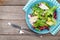 Plate with fresh salad, knife and fork. Diet food