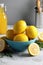 Plate of fresh sliced lemons, rosemary, bottle with lemon drink