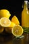 Plate of fresh sliced lemons, rosemary, bottle with lemon drink