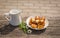 Plate of fried homemade cheese paneer with milk - country meal