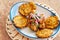 A plate of fried plantain with shredded beef