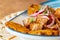 A plate of fried plantain with shredded beef macro