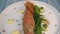 Plate of fried small fish red mullet with green asparagus