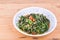 Plate of fried sweet potato leafs, delicacy among Asians