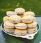 Plate full of cornstarch alfajores filled with dulce de leche. Typical South American dessert.