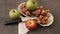 A plate full of Jerusalem artichoke and a green and red apple knife next to it