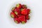 Plate full of tasty juicy strawberries and chocolate isolated on black background high angle top above close up view of yummy tast