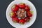 Plate full of tasty juicy strawberries and chocolate isolated on black background weight loss slimming temptation weightloss top a