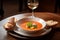 plate of gazpacho, served with crusty bread and glass of chilled white wine