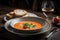 plate of gazpacho, served with crusty bread and glass of chilled white wine