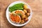 Plate of grilled chicken, asparagus and baked potatoes, top view