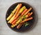 Plate of grilled colorful carrots