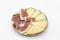 Plate of ham and cheese on white background