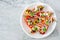 Plate of healthy stuffed mini peppers on a light background