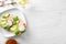 Plate with healthy toasts on white wooden table