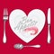 On a plate with a heart shape lies a shrimp, a knife, a fork and a spoon
