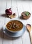 Plate of homemade lentils on white rustic background