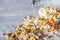 Plate of homemade muesli with pumpkin seeds, flower dust, candied fruit, freeze dried apricot