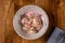 Plate of italian homemade ravioli pasta with arugula microgreen