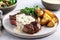 plate of juicy steak, drizzled with creamy garlic sauce and served alongside perfectly seasoned potatoes