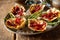 Plate of Kilpatrick Oysters on Wood Table