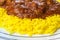 Plate of lamb jalfrezi curry and pilau rice