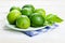 Plate of limes on napkin,close up