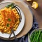 A plate of macaroni and cheese with a side of green beans3, Generative AI