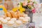 a plate of macarons cakes and ladies' fingers biscuits.