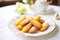 plate of madeleines with a fine dusting of sugar