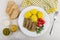 Plate with meat aspic, potatoes, tomatoes, horseradish, mustard, green peas