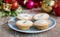 Plate with mince pies and christmas decorations