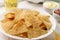 Plate of nacho corn chips and dips