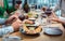 Plate of nice food in a fancy restaurant on table with people eating