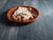 Plate with nougat on a wooden table