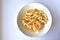 Plate with onion rings snacks on a white background