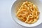 Plate with onion rings snacks on a white background