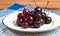 Plate of organic cherries