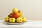 A plate overflowing with delicious ripe pears on a white shelf