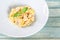 Plate of pasta fetuccini with salmon and parmesan cheese