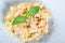 Plate of pasta fetuccini with salmon and parmesan cheese