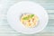 Plate of pasta fetuccini with salmon and parmesan cheese