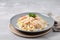 plate of pasta with shrimps in creamy alfredo sauce