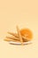 A plate of pastila with orange on a beige background. Free space for text.