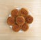 Plate of pecan sweet rolls on a wood table