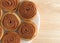 Plate of pecan sweet rolls on a wood table