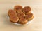 Plate of pecan sweet rolls on a wood table