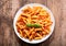 Plate of penne pasta bolognese